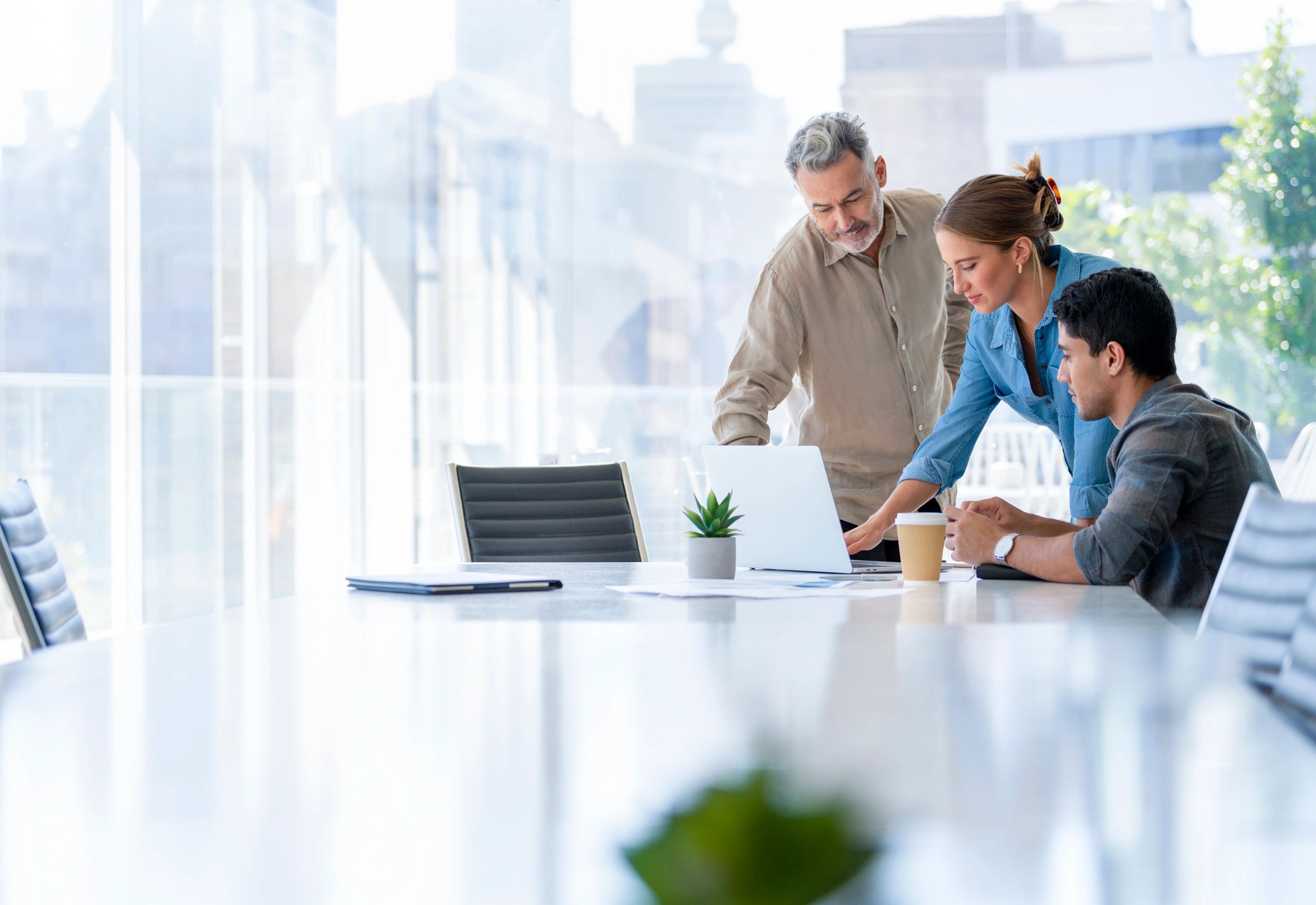 Team collaborating in a boardroom, representing finance and operations teamwork.