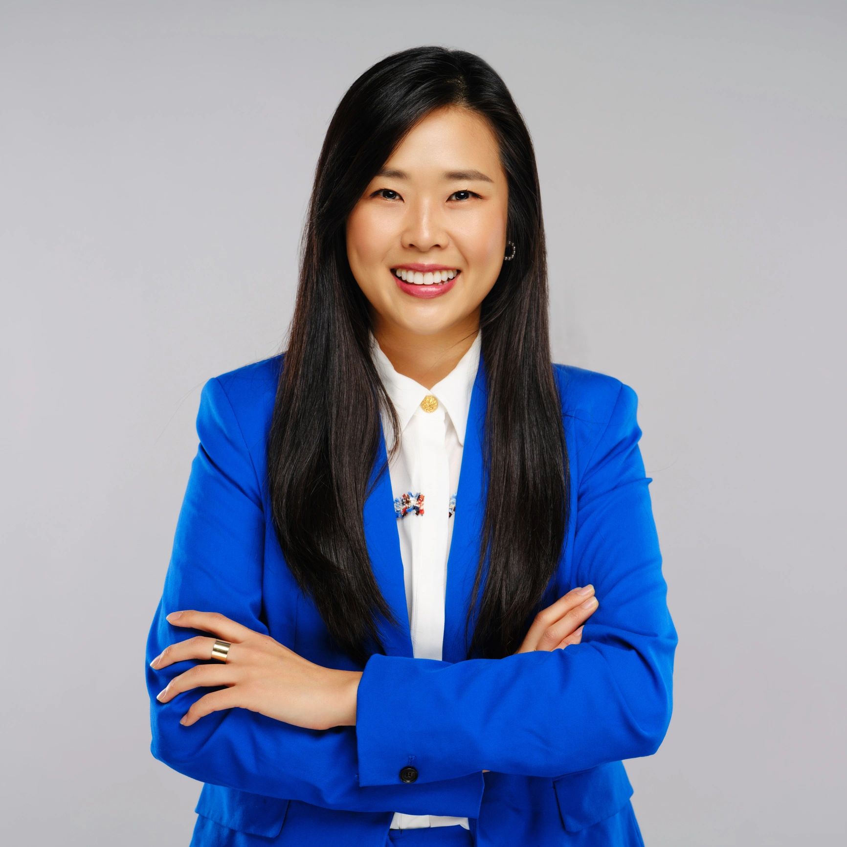 Professional studio headshot of a businesswoman