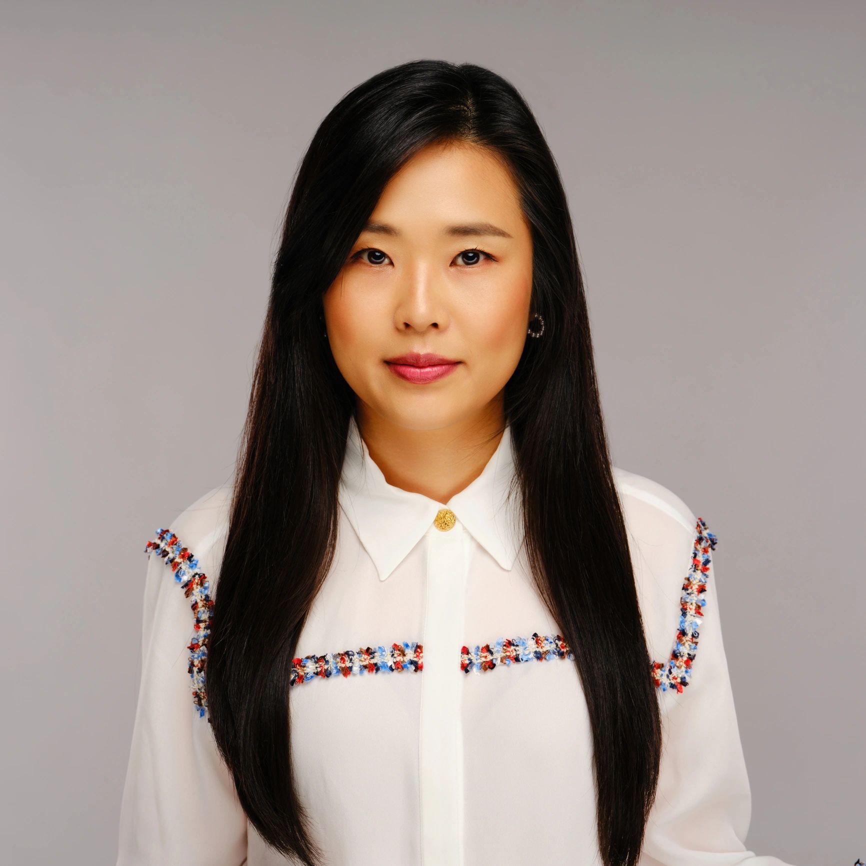Professional studio headshot of a businesswoman
