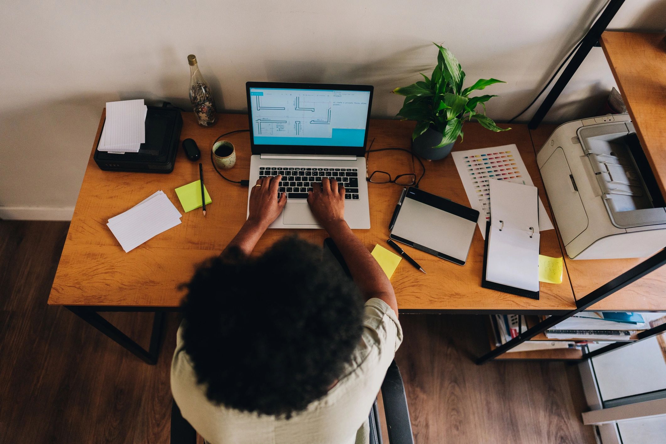 Remote administrator working from home on a laptop