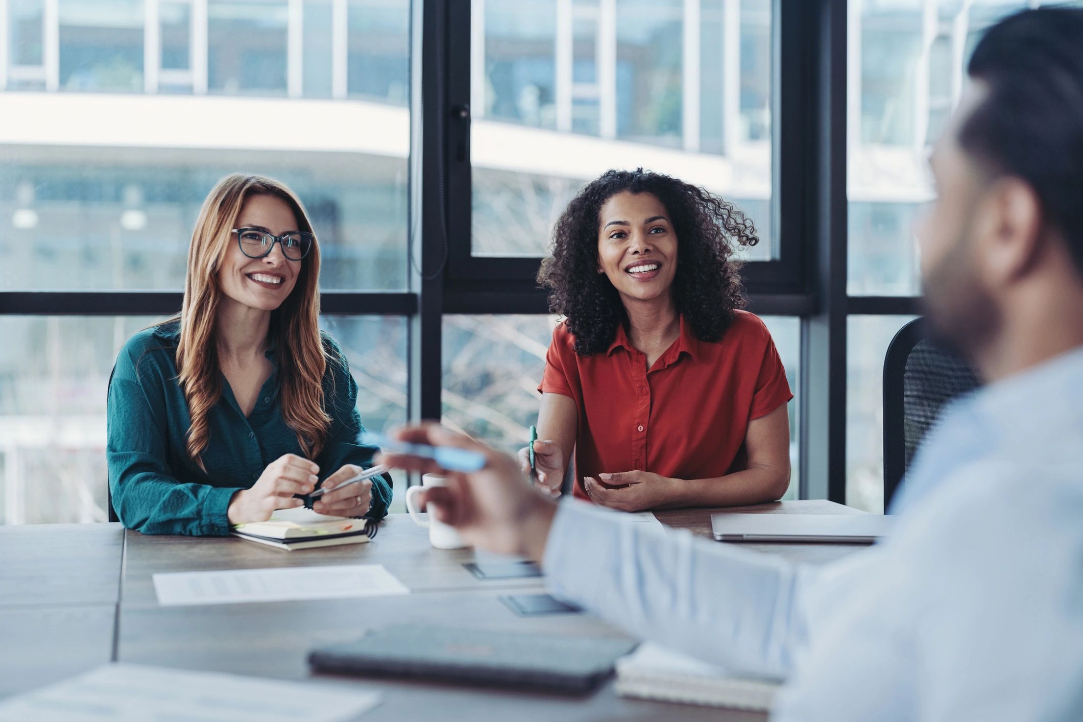 Business professionals discussing work in an office
