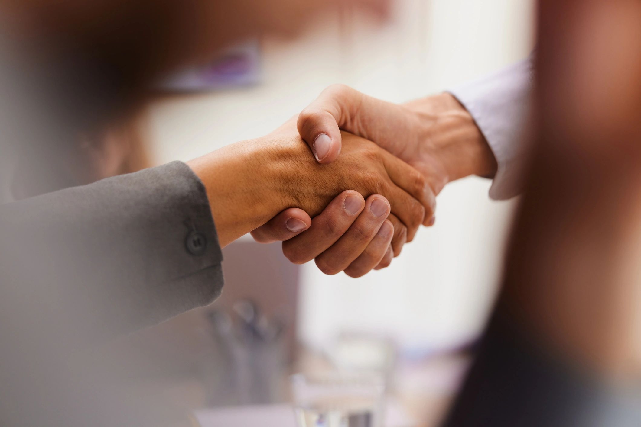 Two professionals shaking hands after an interview